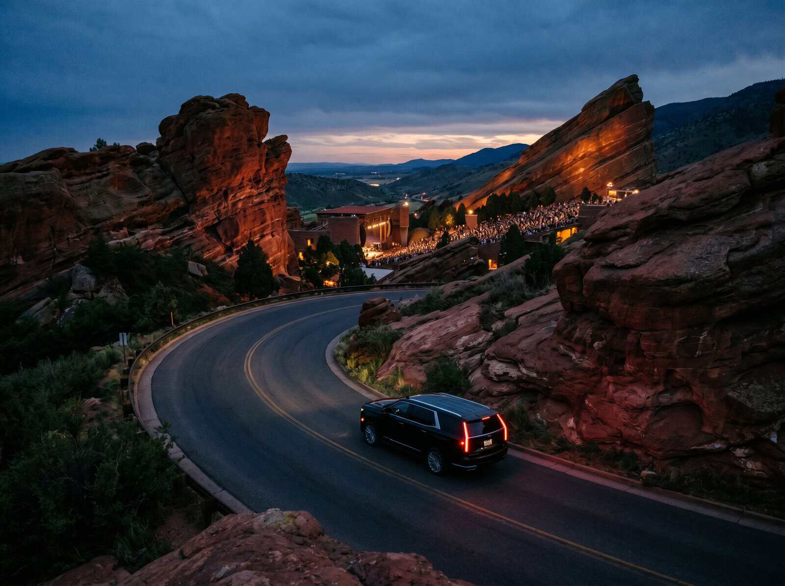 01 pulling up to red rocks in a private SUV