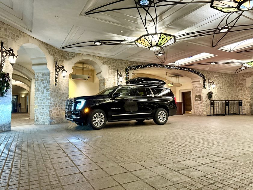 Blue Sky Limo GMC Yukon Denali XL at a Beaver Creek resort entrance
