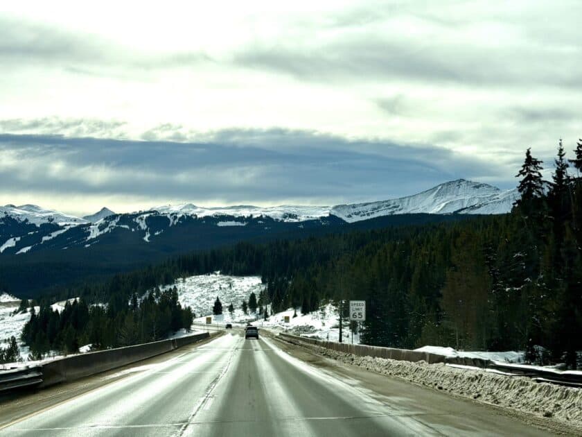 Winter driving on I-70 over Vail Pass with Copper Mountain ahead on the Eagle Airport to Breckenridge route