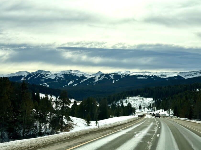 Winter driving on I-70 near Vail Pass with snow covering the highway