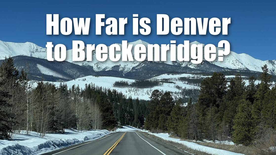 How far is Denver to Breckenridge? The highway into Breckenridge running toward a wall of snow-covered peaks