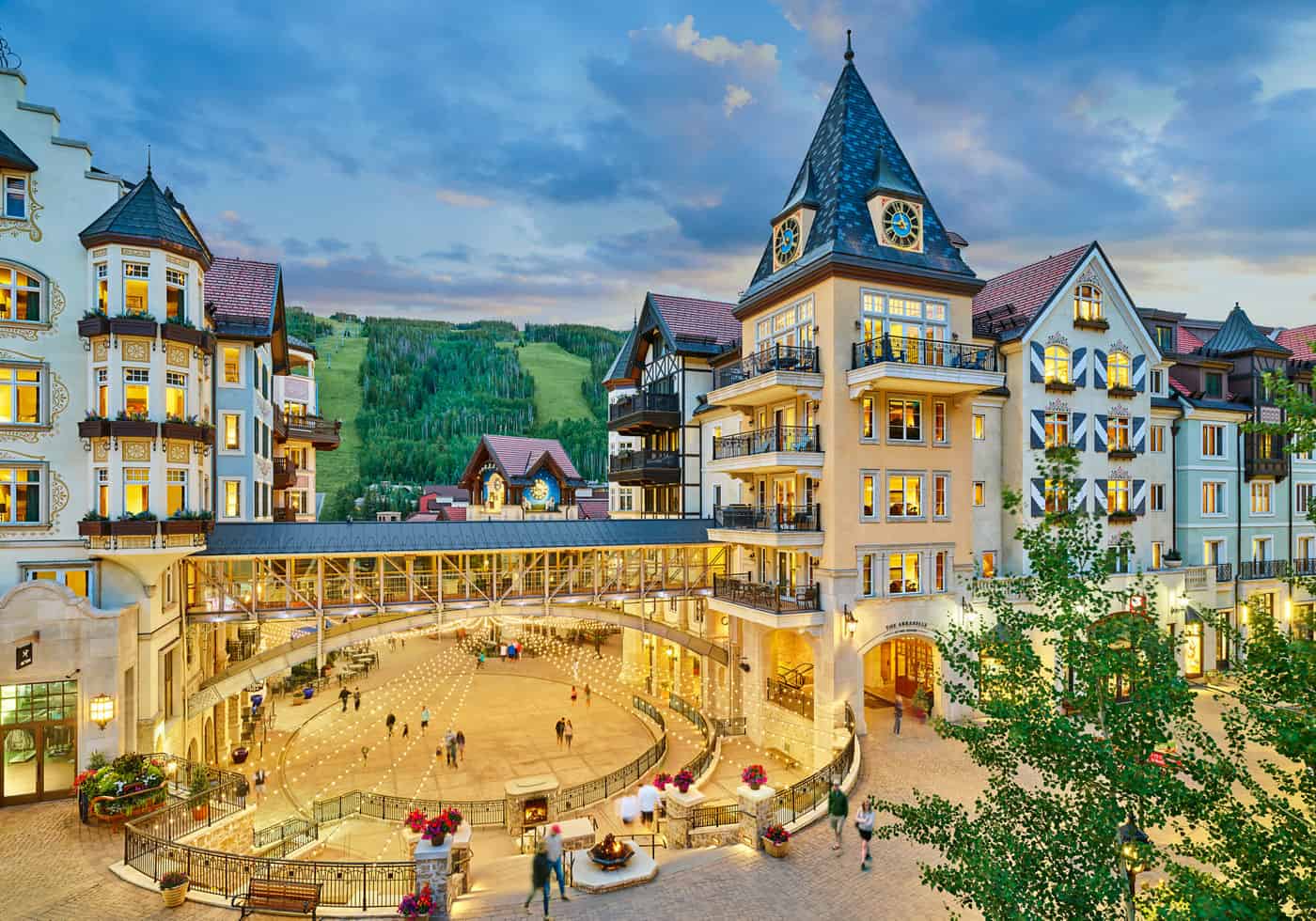 The Arrabelle clocktower and alpine-style buildings around Vail Square, with Vail Mountain behind