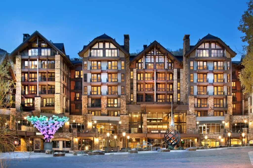 Solaris Residences illuminated at dusk above the plaza in Vail Village